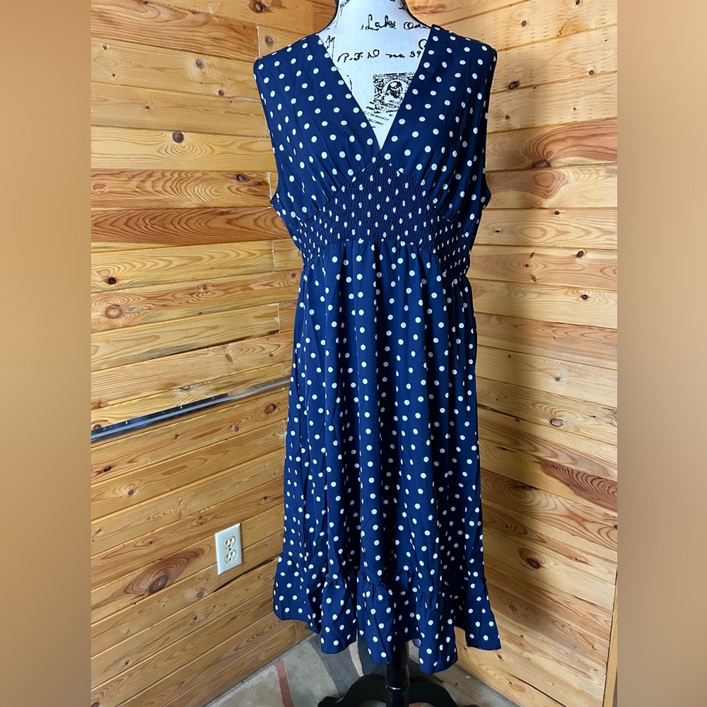 Navy blue and white polka dot sleeveless dress